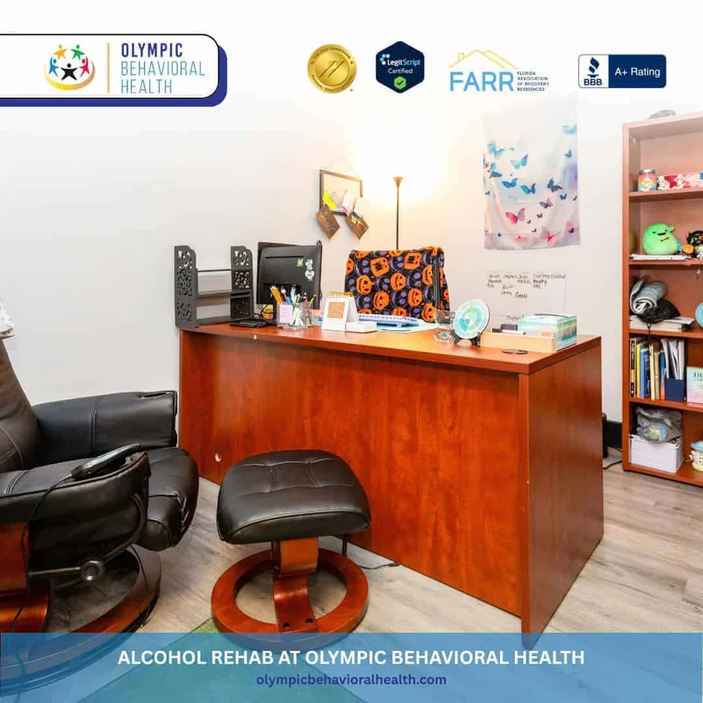 Therapist office with a wooden desk and leather recliner, captioned Alcohol Rehab at Olympic Behavioral Health
