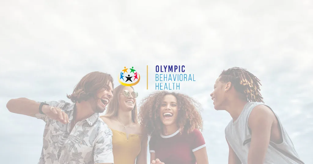 Four friends laughing together outdoors under the Olympic Behavioral Health logo, a call to action for treatment programs