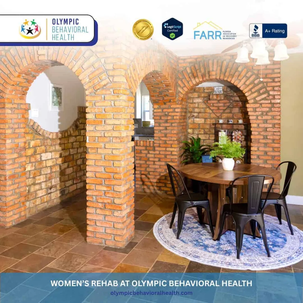 Brick archways and round dining table with blue rug, captioned Women's Rehab at Olympic Behavioral Health