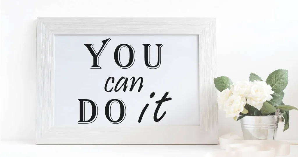 Framed sign reading You Can Do It beside white flowers, encouraging partners who love someone with addiction